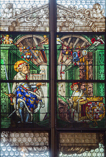 In the dextral window, King Ferdinand I of Hungary († 1564), later crowned Emperor, is portrayed before St Leopold, patron saint of Austria.