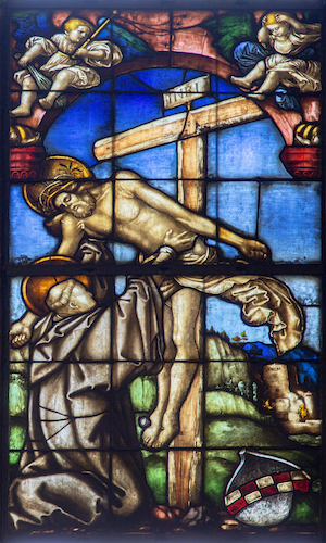 In this window, the holy Cistercian abbot Bernard of Clairvaux kneels to receive the body of Christ from the cross.