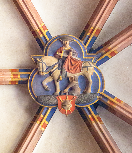 The boss in the chapel depicts St Martin with a horse and a beggar.