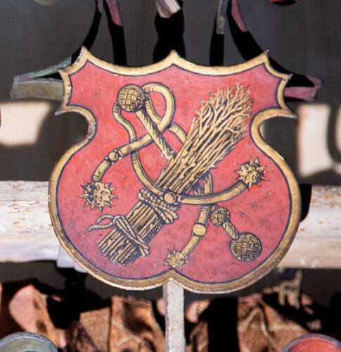 Coat of arms with medieval weapons.