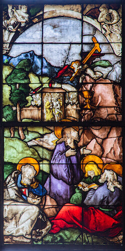 Fearing for his life, Jesus prays before a rock in the Garden of Gethsemane. The depicted chalice and the cross carried by the angel symbolise Jesus' imminent sacrificial death. The sleeping disciples Peter, John and James Maior lie in the foreground. The approaching executioners who will take Jesus prisoner can already be seen through a garden gate.