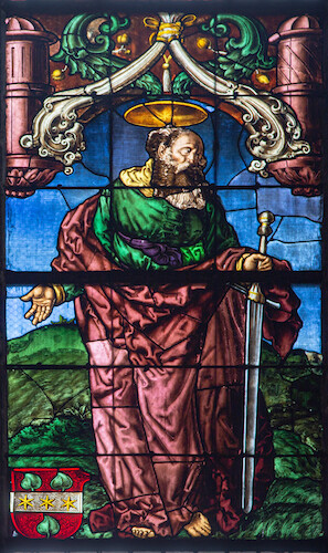 The apostle Paul is portrayed with his attribute, the sword. His open arms show the saint in an embracing gesture, even though his gaze – like that of the Suter brothers – is directed to the right. The red coat of arms in the bottom corner is the coat of arms of the Schrag family: the mother of the Suter siblings. It shows three golden stars on a silver bar with lime leaves on a red shield.