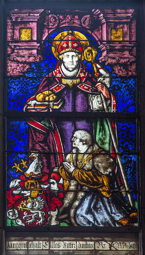 This stained-glass window on the left depict the donor kneeling with the Stürtzel coat of arms before St Nicholas.