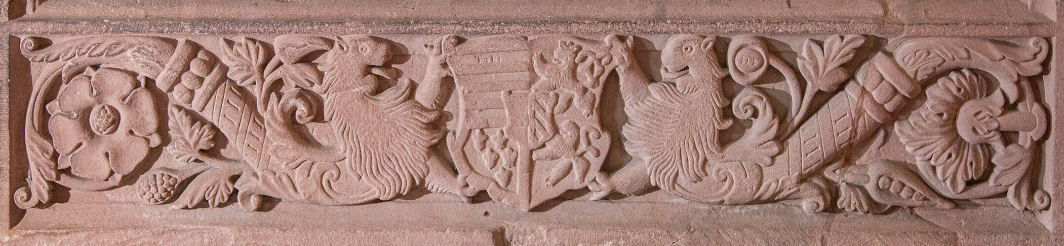 On the right, the Habsburg coat of arms is presented by lions.