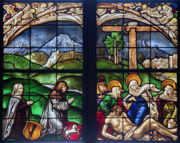 In the window, the donor and his wife, Verena Schmid, are depicted kneeling humbly before a portrayal of the Lamentation of Christ with John the Apostle, Joseph of Arimathea, Mary, and Mary Magdalene.